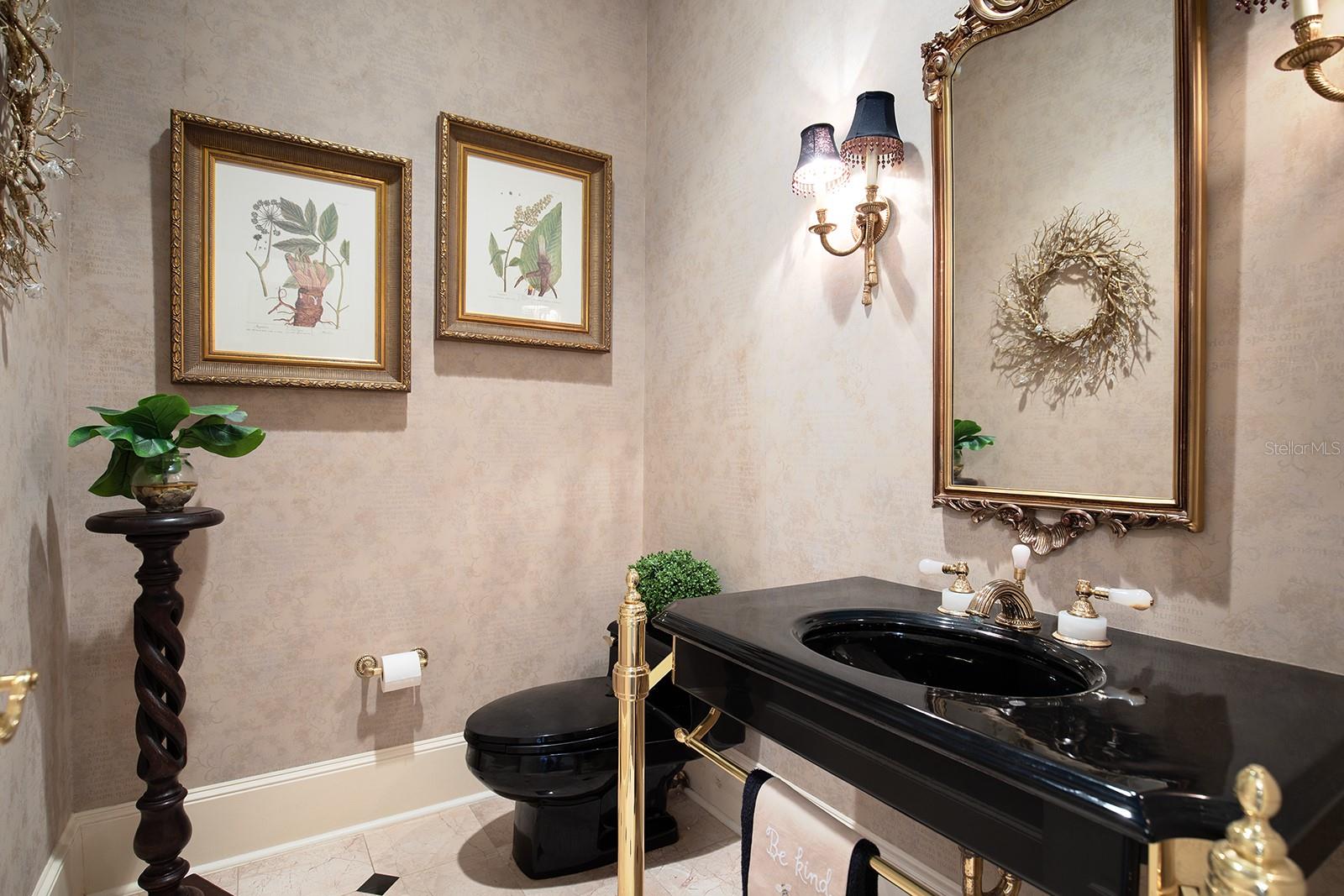Downstairs half bath right off the office (5th bedroom, no closet)