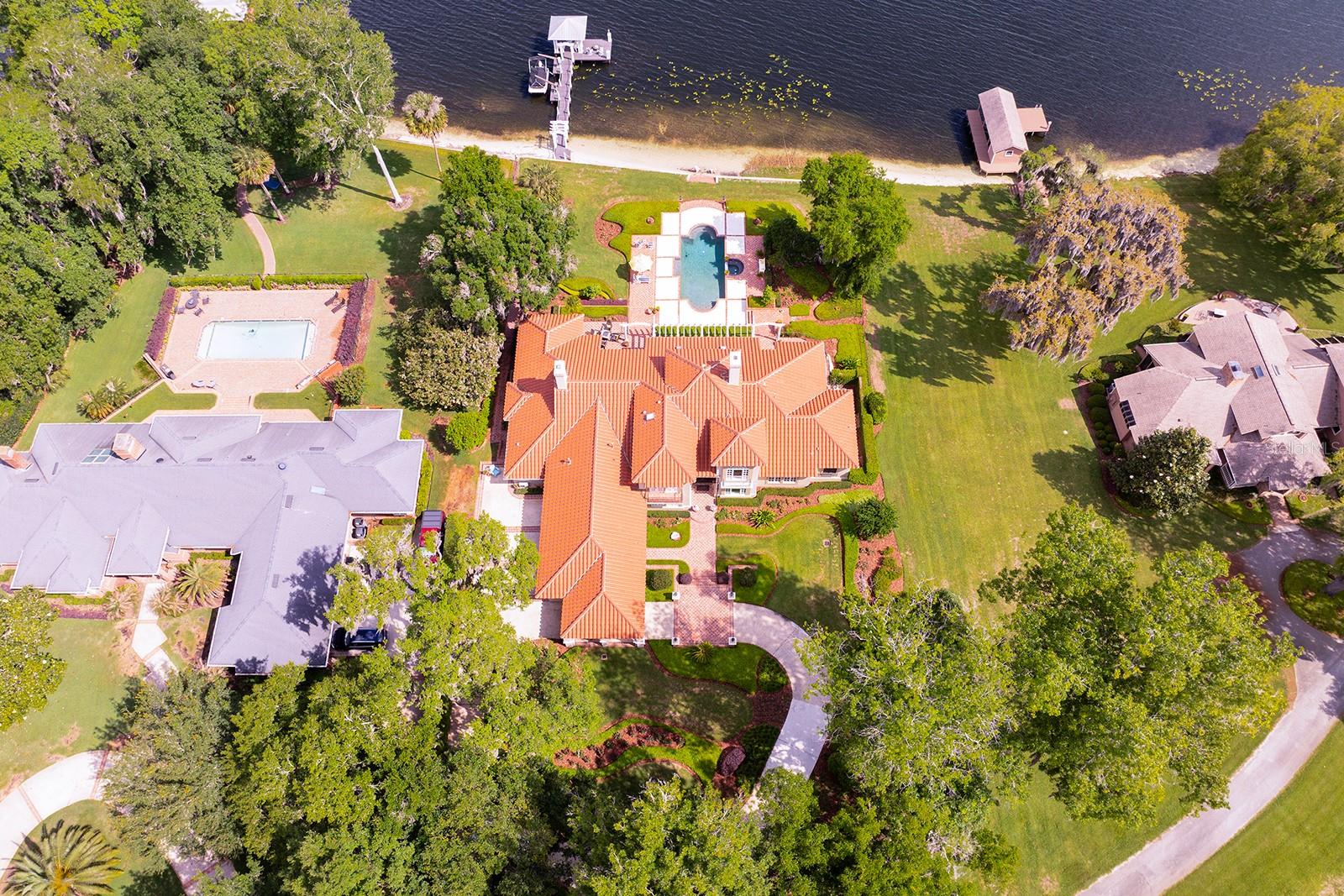 CUSTOM BUILT SHOWPLACE is nestled back on a LUSH, PRIVATE ENCLAVE oversized flag lot of *4.08-Acres *Over 1 + acres for residence.