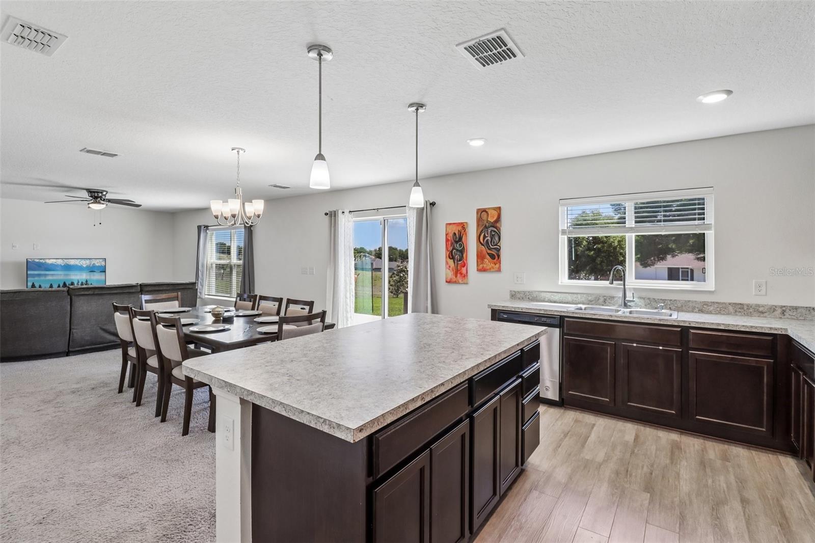 Kitchen is open to the dining and living areas. Kitchen is open to the dining and living areas.