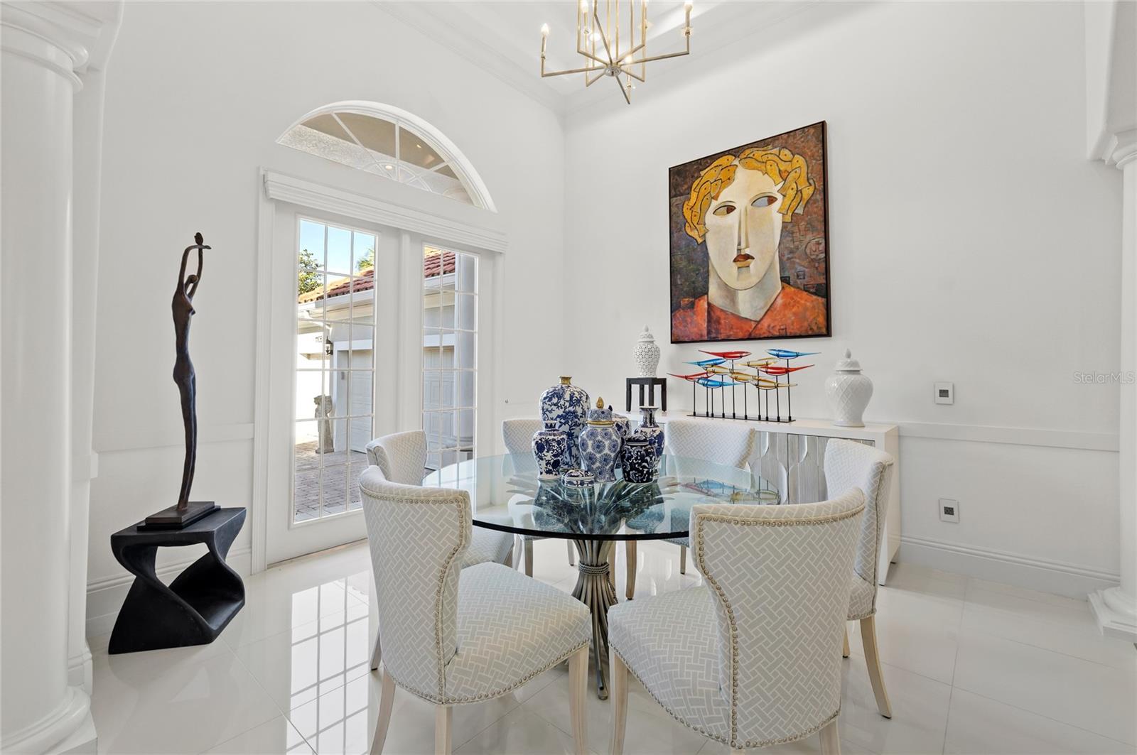 Formal dining space with abundant light. 1st hall leads to Beds 3 & 4, laundry and 3 car garage access Formal dining space with abundant light. 1st hall leads to Beds 3 & 4, laundry and 3 car garage access