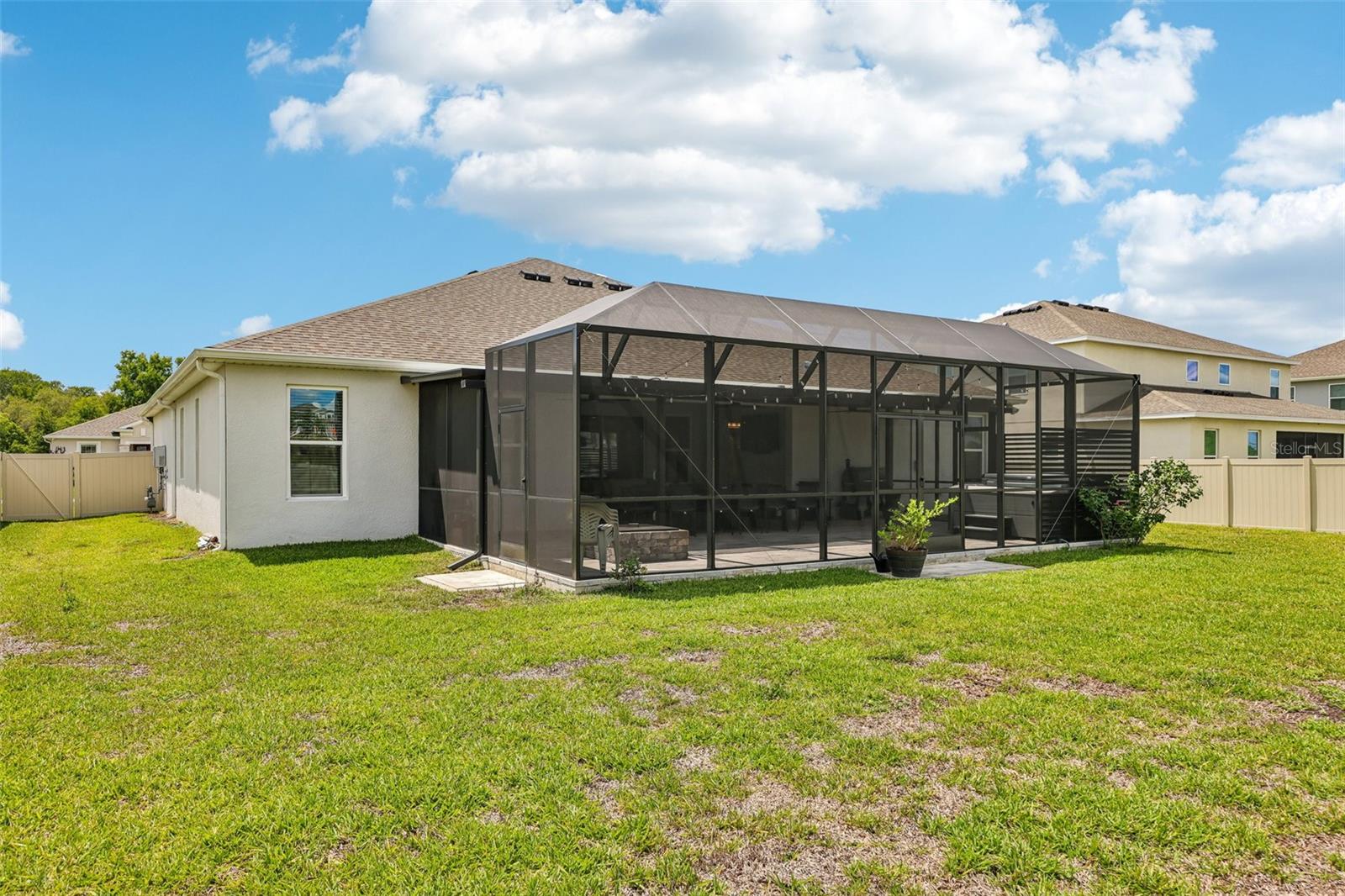Extended lanai is full screened for year-round comfort.