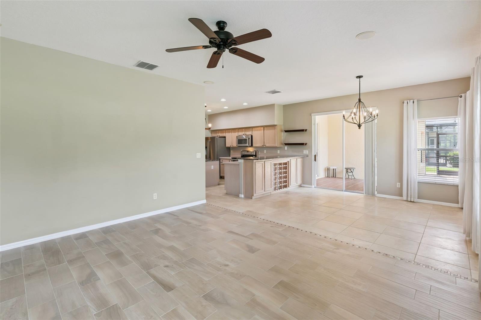 Kitchen area leads out to screened patio.