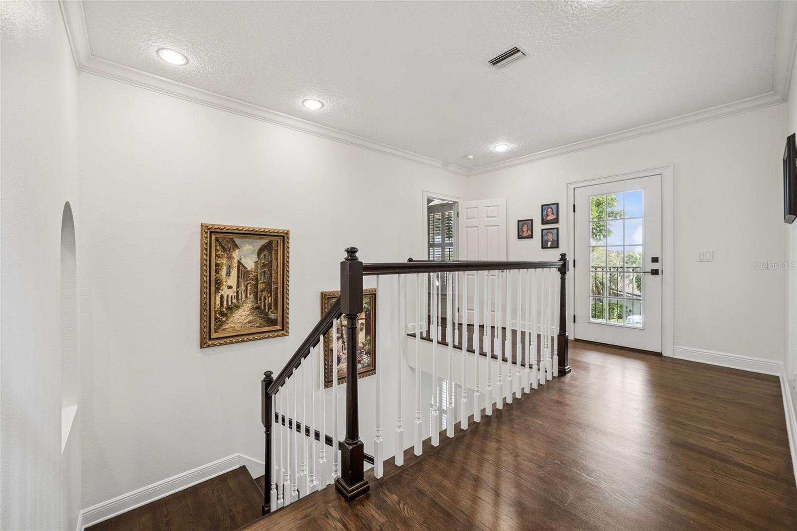 Upstairs landing with large front porch over looking Lake Osceola