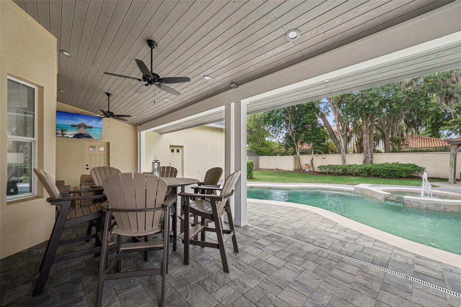 Pool area with new paver deck and covered lanai