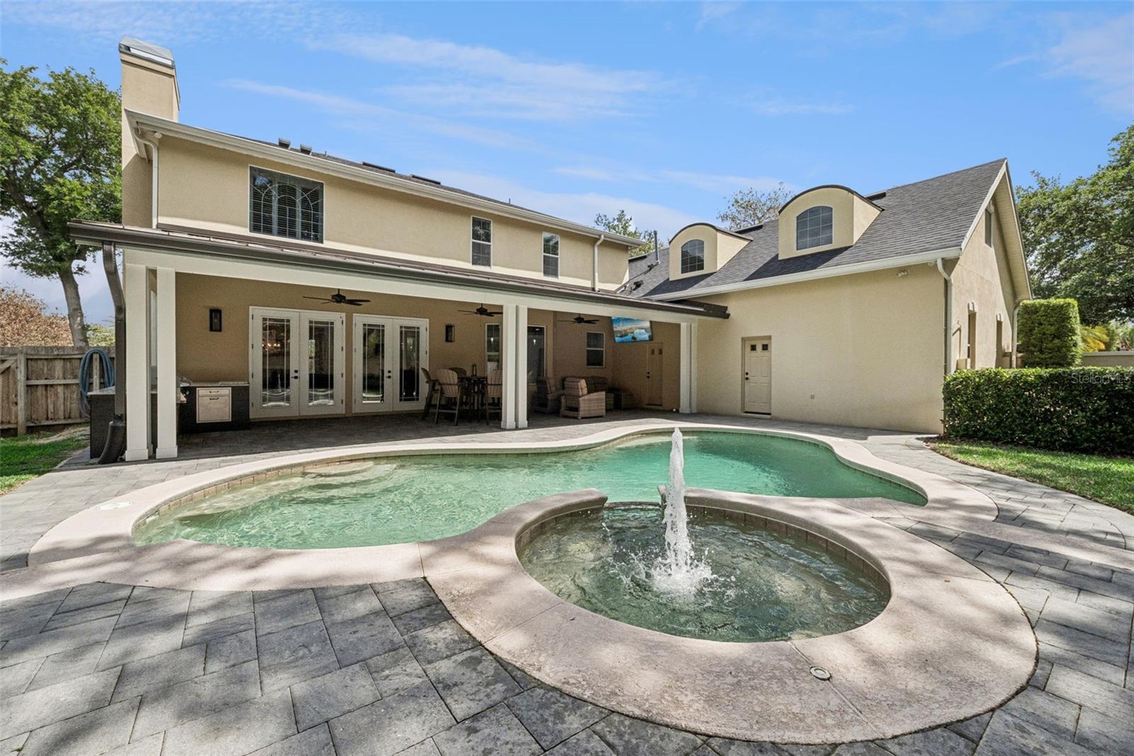 Pool, jacuzzi and backyard area