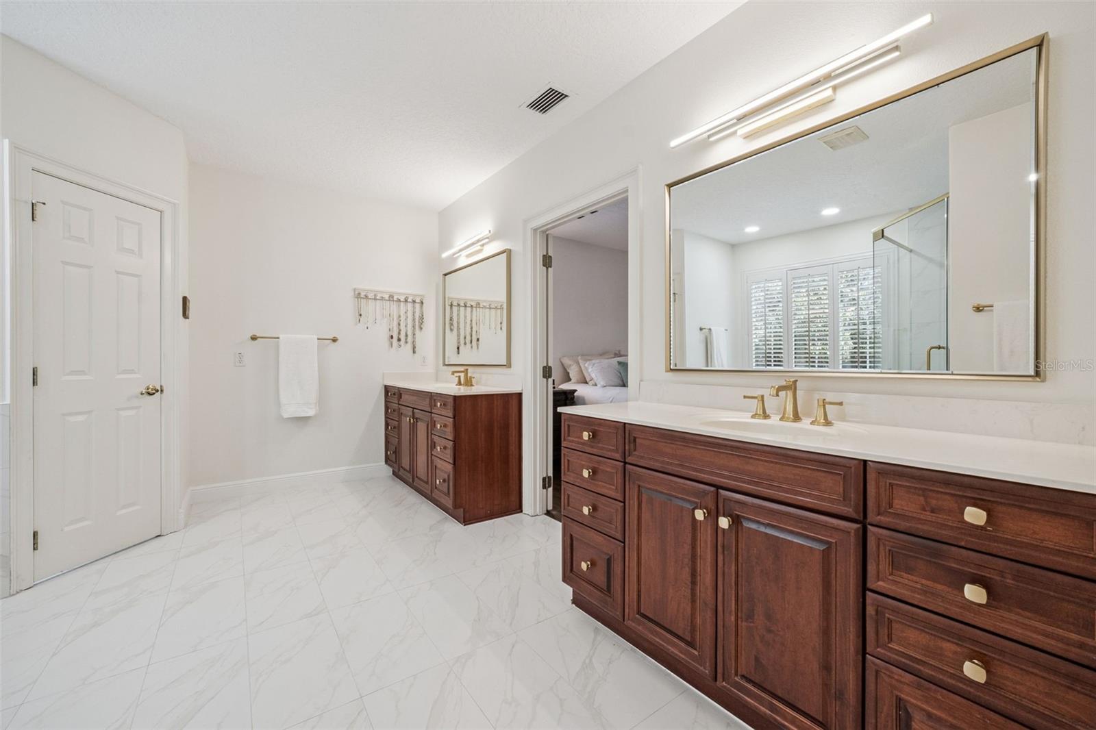 Updated primary bathroom with double vanities