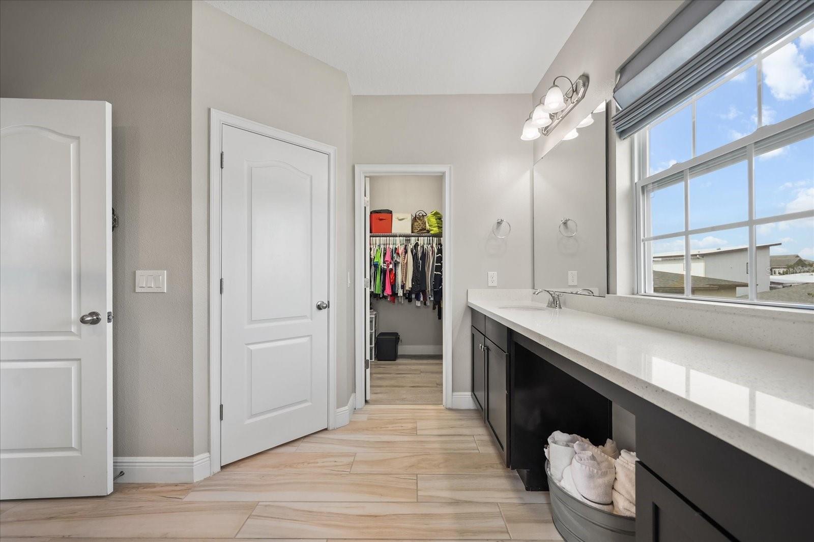Primary bathroom with walk-in closet