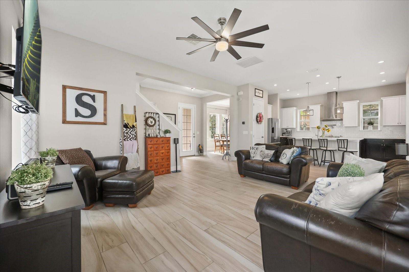 Family room looking to front door/dining room/kitchen