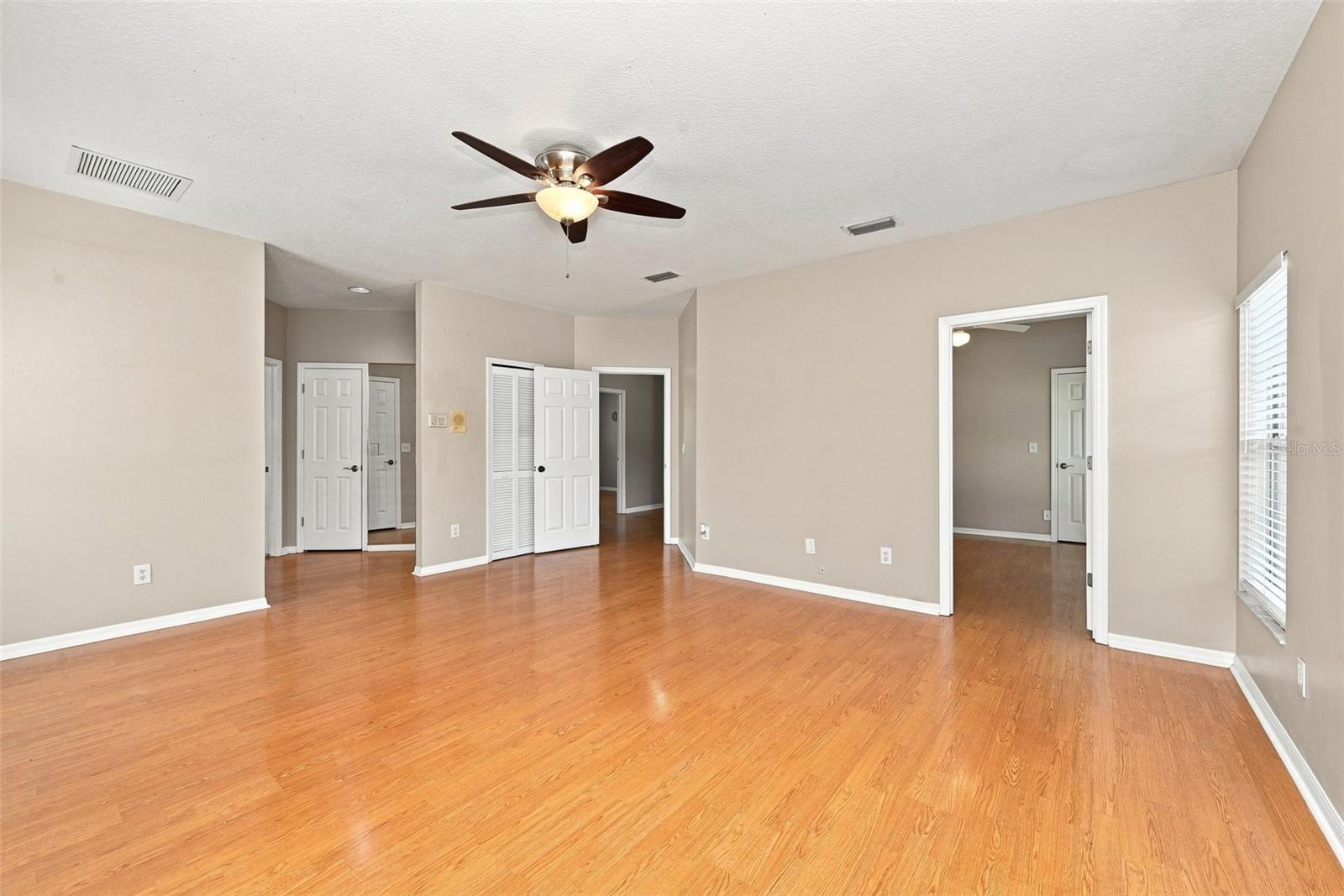 Versatile Primary Suite Layout includes generous bedroom space and an adjoining room that can function as a nursery, office, gym, sitting room, or private retreat.