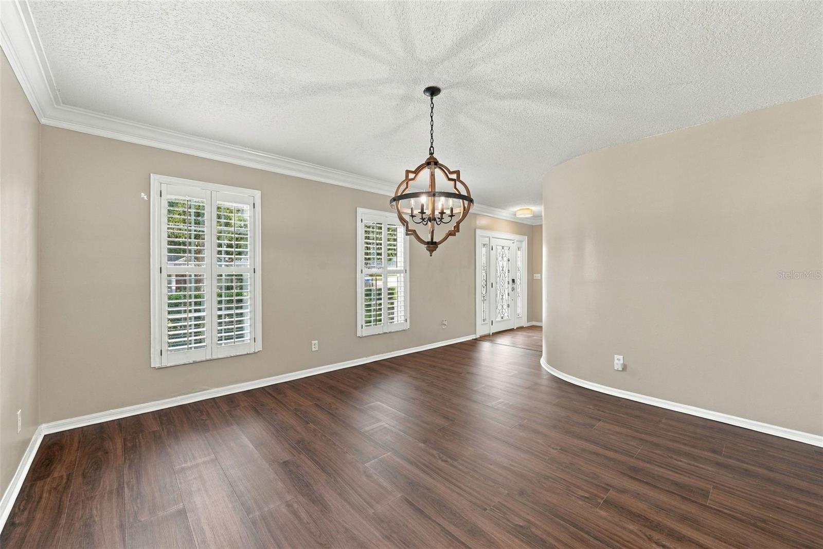 Dining room with Brand New LVP Flooring and plantation shutters