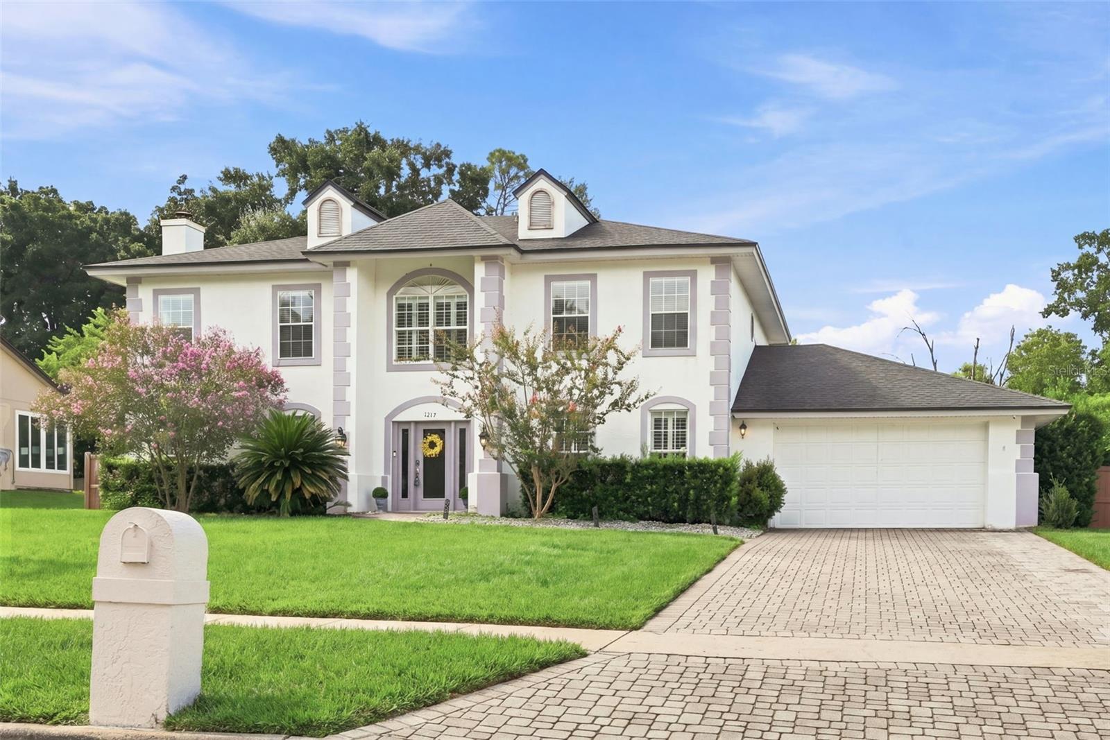 Expanded Paver Driveway leading to 2+ car garage
