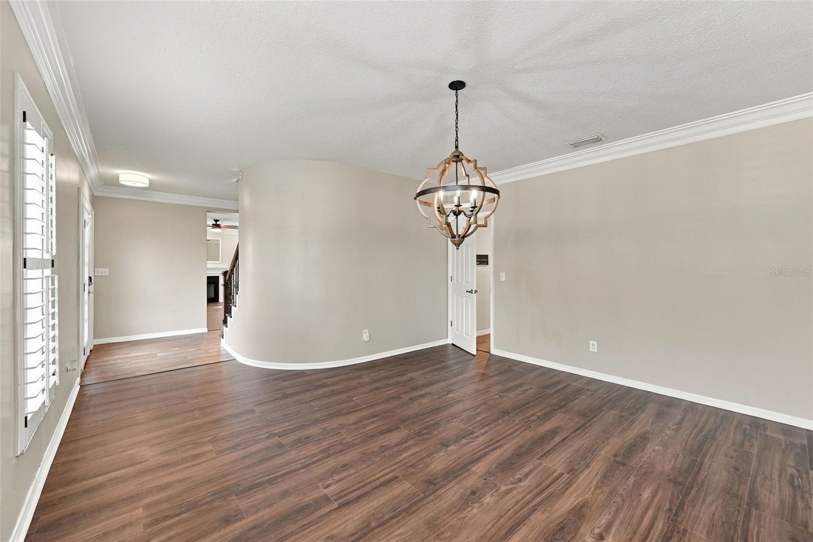 Dining room with Brand New LVP Flooring and plantation shutters