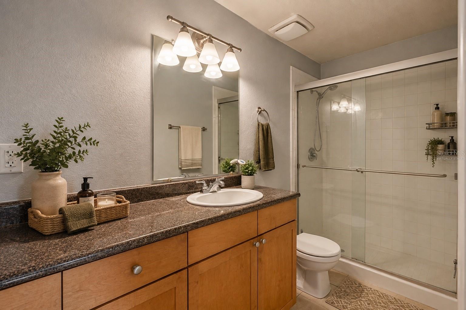 Virtually Staged First Bedroom Bathroom