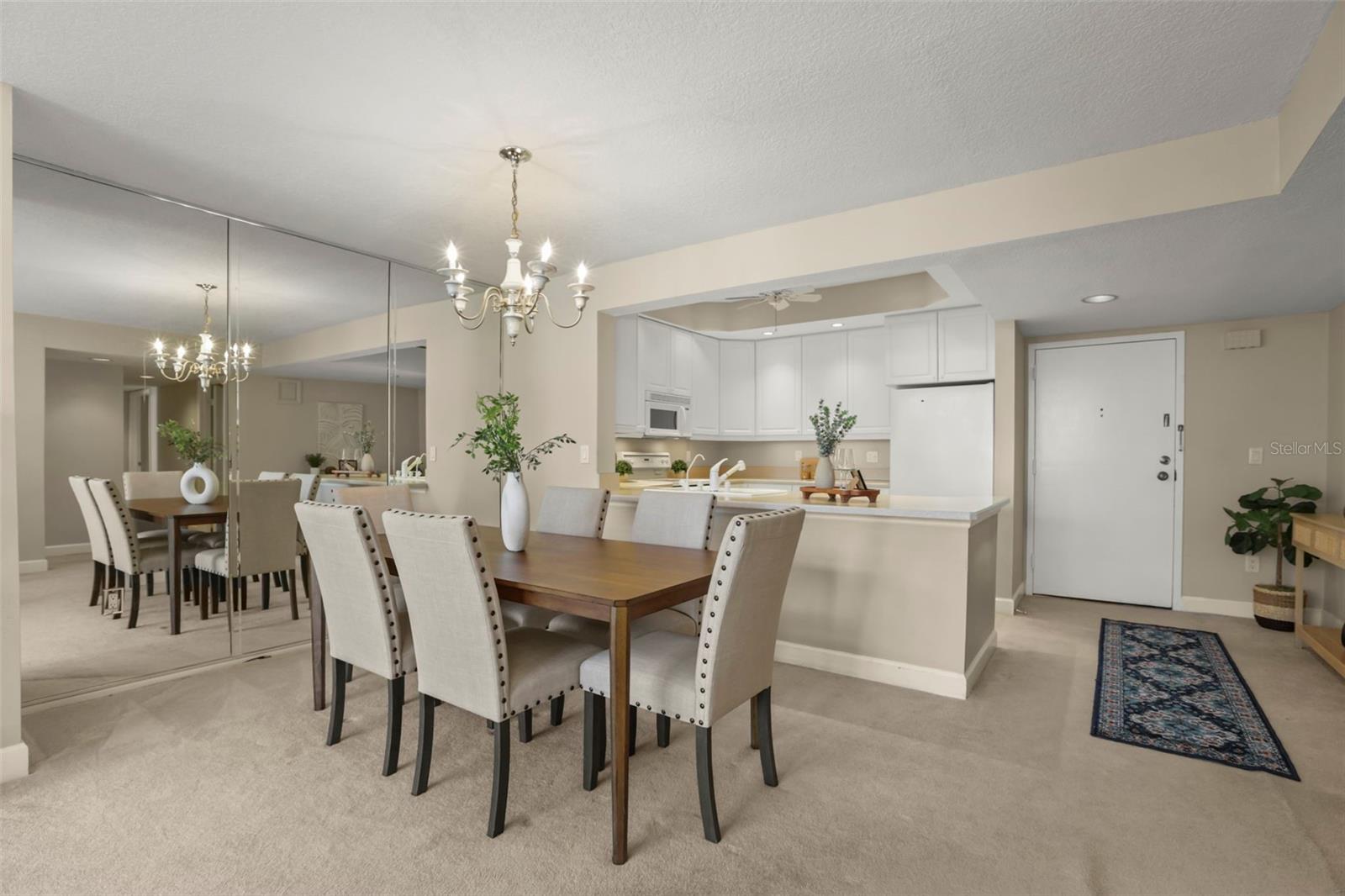 The dining room and large foyer frame the kitchen.