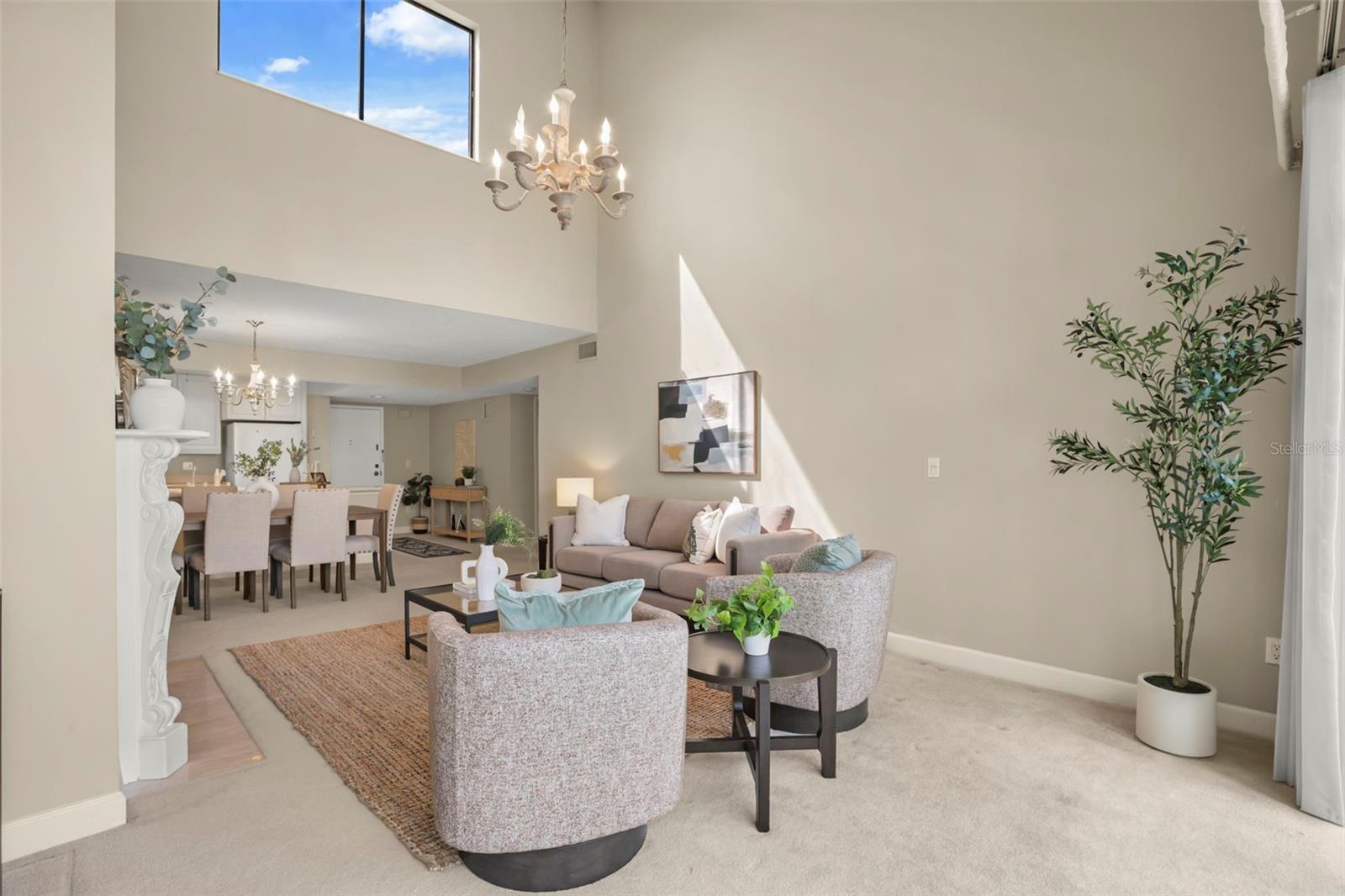 The top-floor location means natural light fills the large living room with additional windows along the vaulted ceiling!