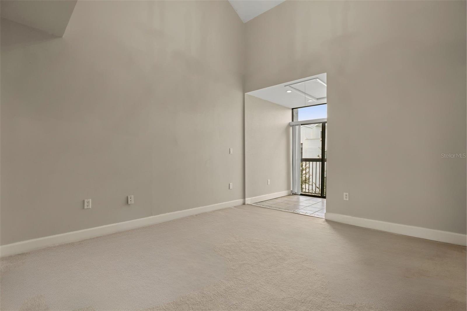 The 2nd bedroom includes its own sunroom with a Juliette balcony and vaulted ceilings to add to the openness. To make maximum use of the vaulted ceilings, an attic storage space was added over the sunroom with approximately 85 square feet of storage space, including shelving and electricity.