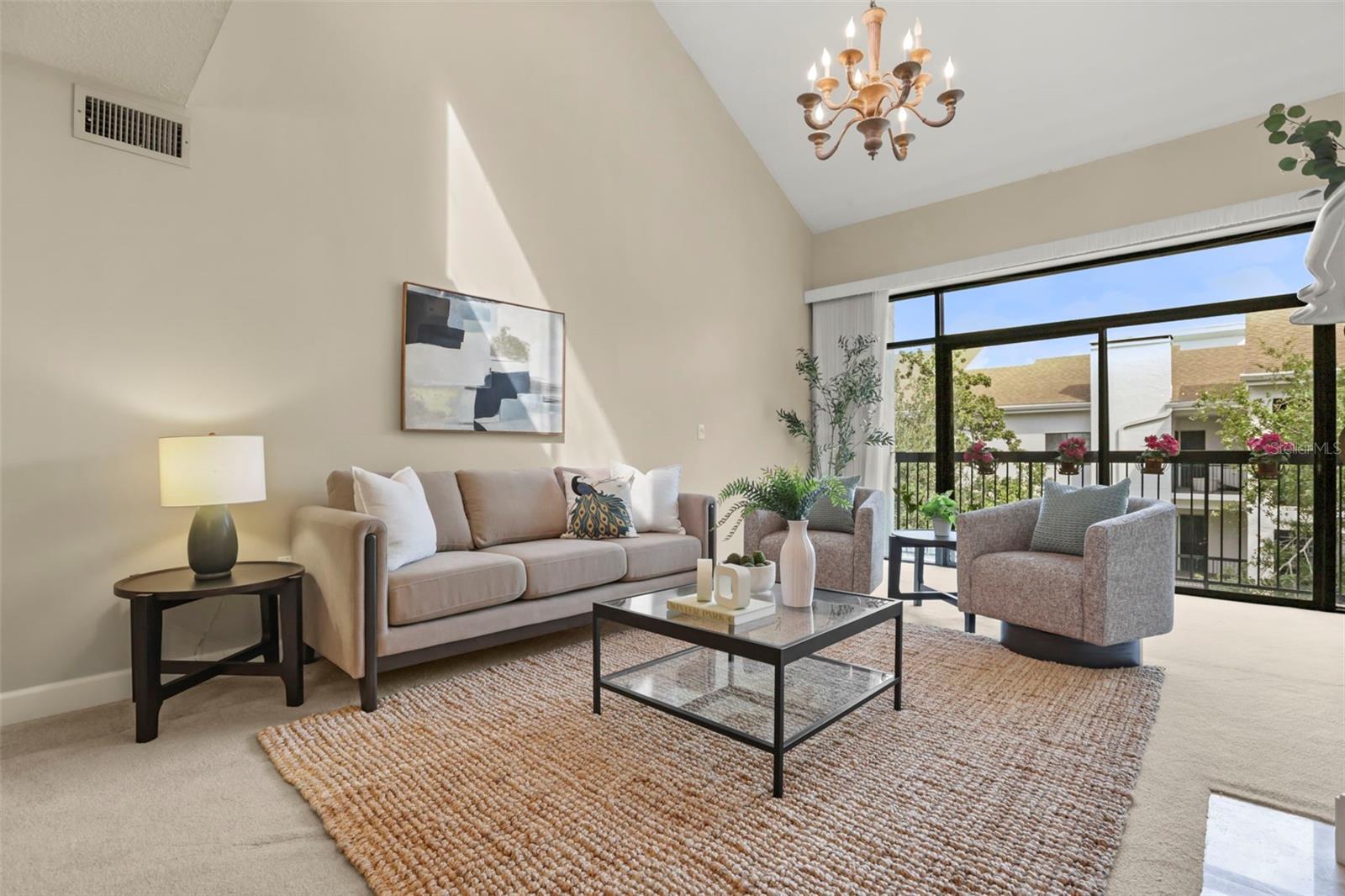 Stress-free condo living doesn't mean smaller space in this spectacular home. The living room is open, bright, and spacious!
