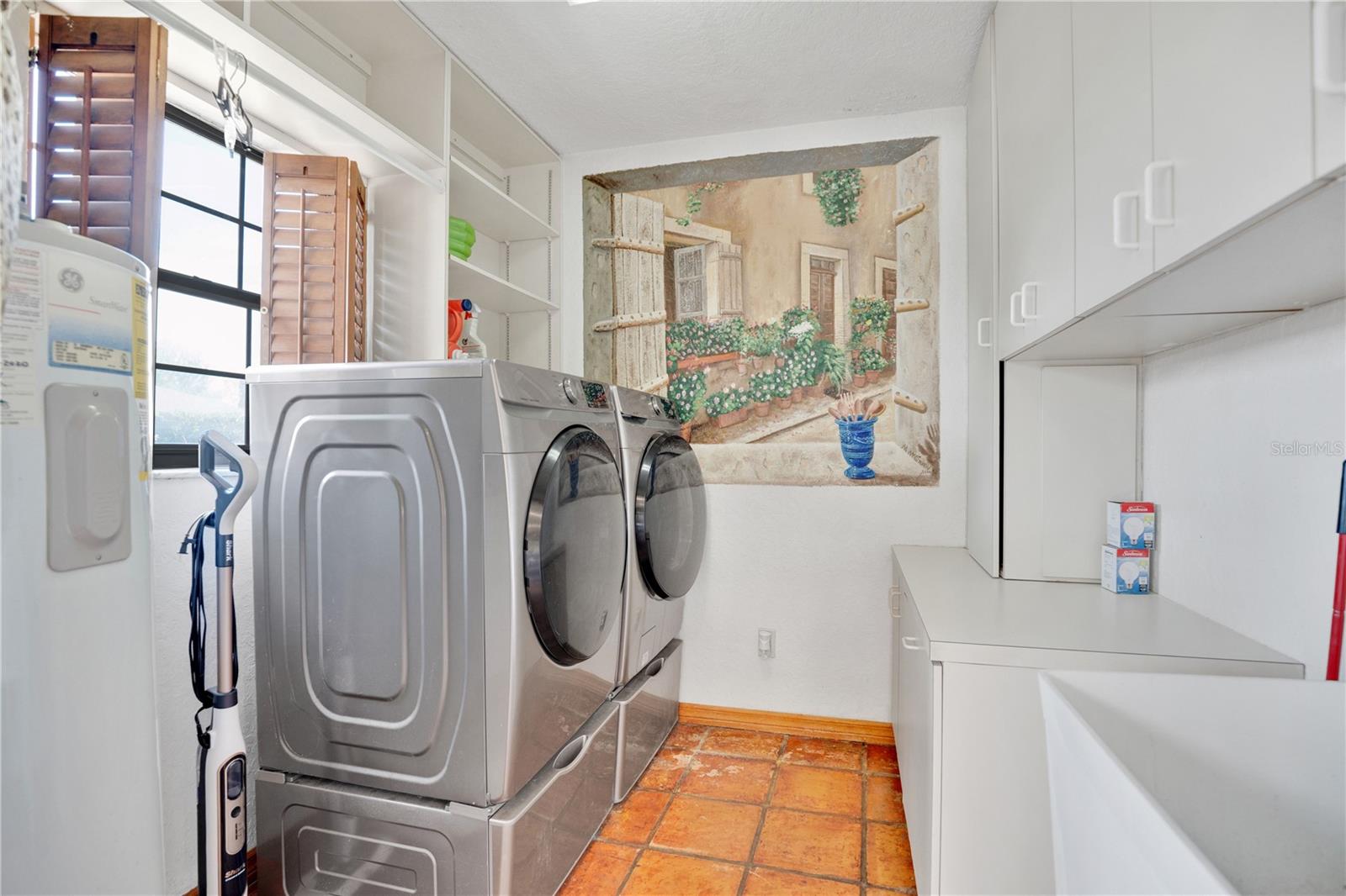 Laundry located right off of the kitchen. Washer and dryer convey.