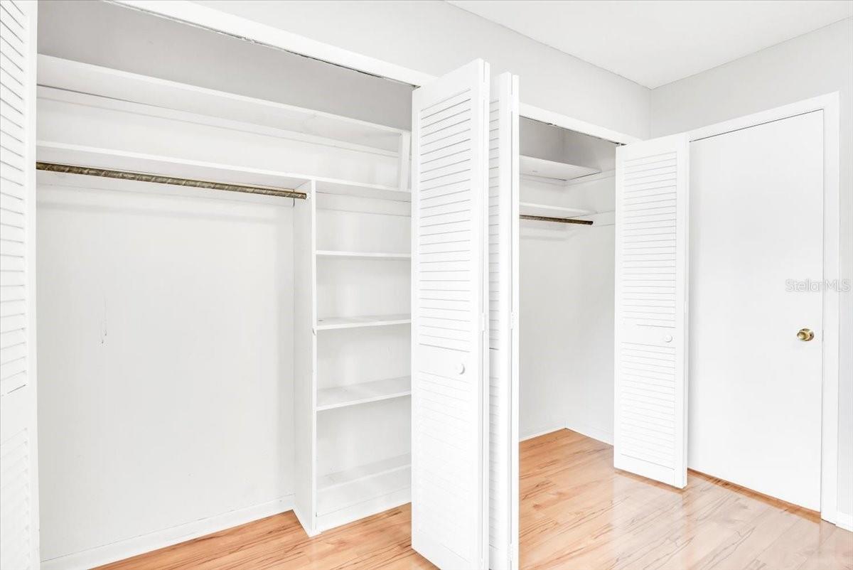 Bedroom #3 features large closet with hardwood flooring.