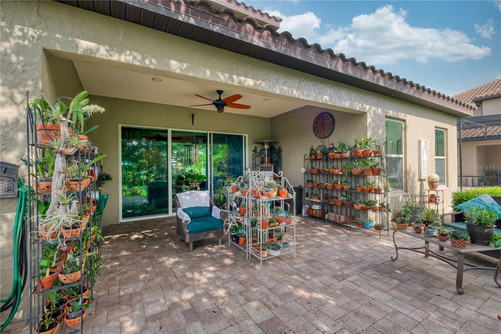 backyard porch featuring sliding doors from behind.