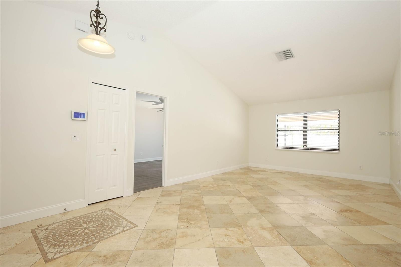 Formal living room with Travertine tile flooring.