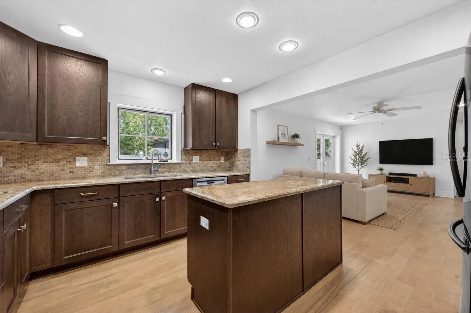 Open concept kitchen & living room - virtually staged
