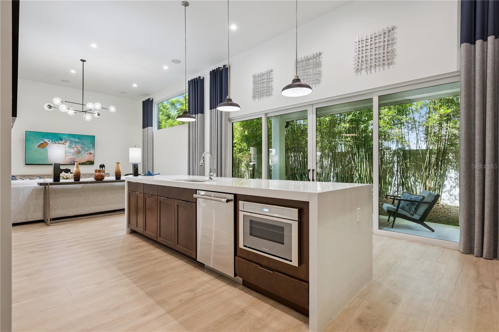 Quartz Waterfall Island with oversized sink and built-in microwave