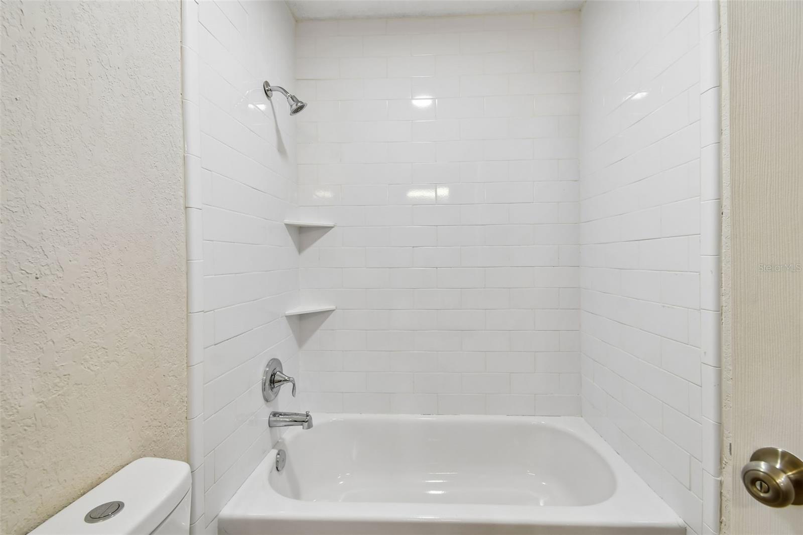 Bathroom 2 with combo shower and tub