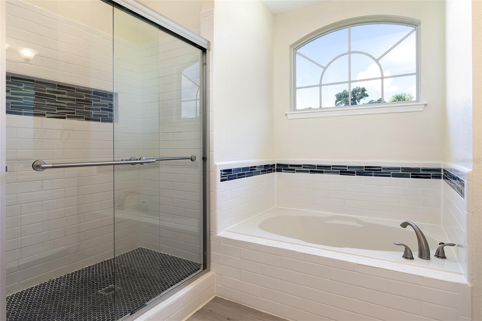 Large walk in shower and soaker tub