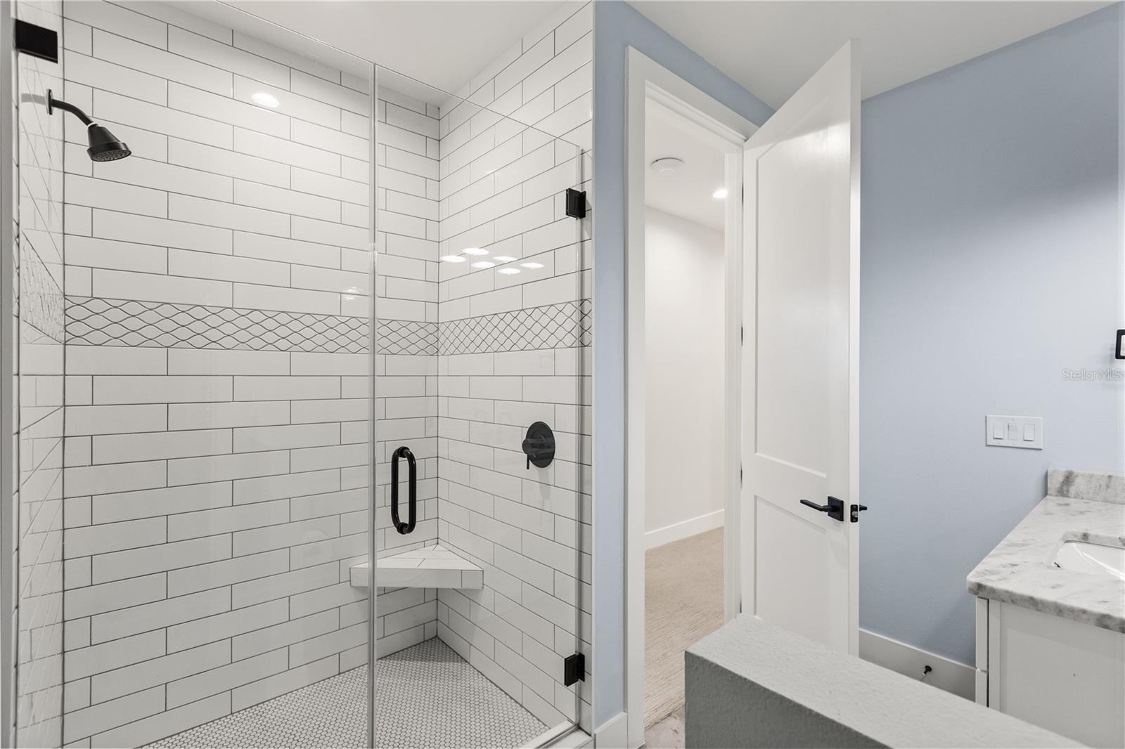 FULL-SIZE WALK-IN SHOWERThe en suite bath features a full-size glass-enclosed walk-in shower, with direct access from the adjoining second-floor bedroom.