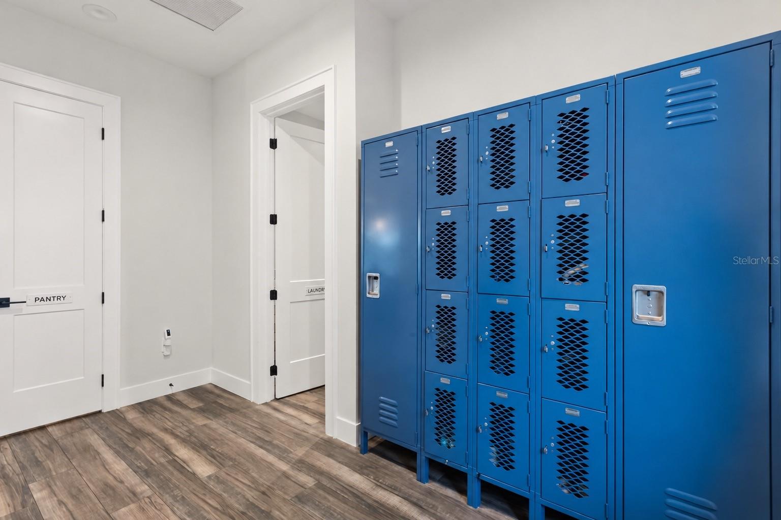 MUDROOM + LOCKER STORAGEJust inside the breezeway, a dedicated mudroom provides individual locker storage for backpacks, shoes and everyday gear, with the laundry room and walk-in pantry immediately adjacent.