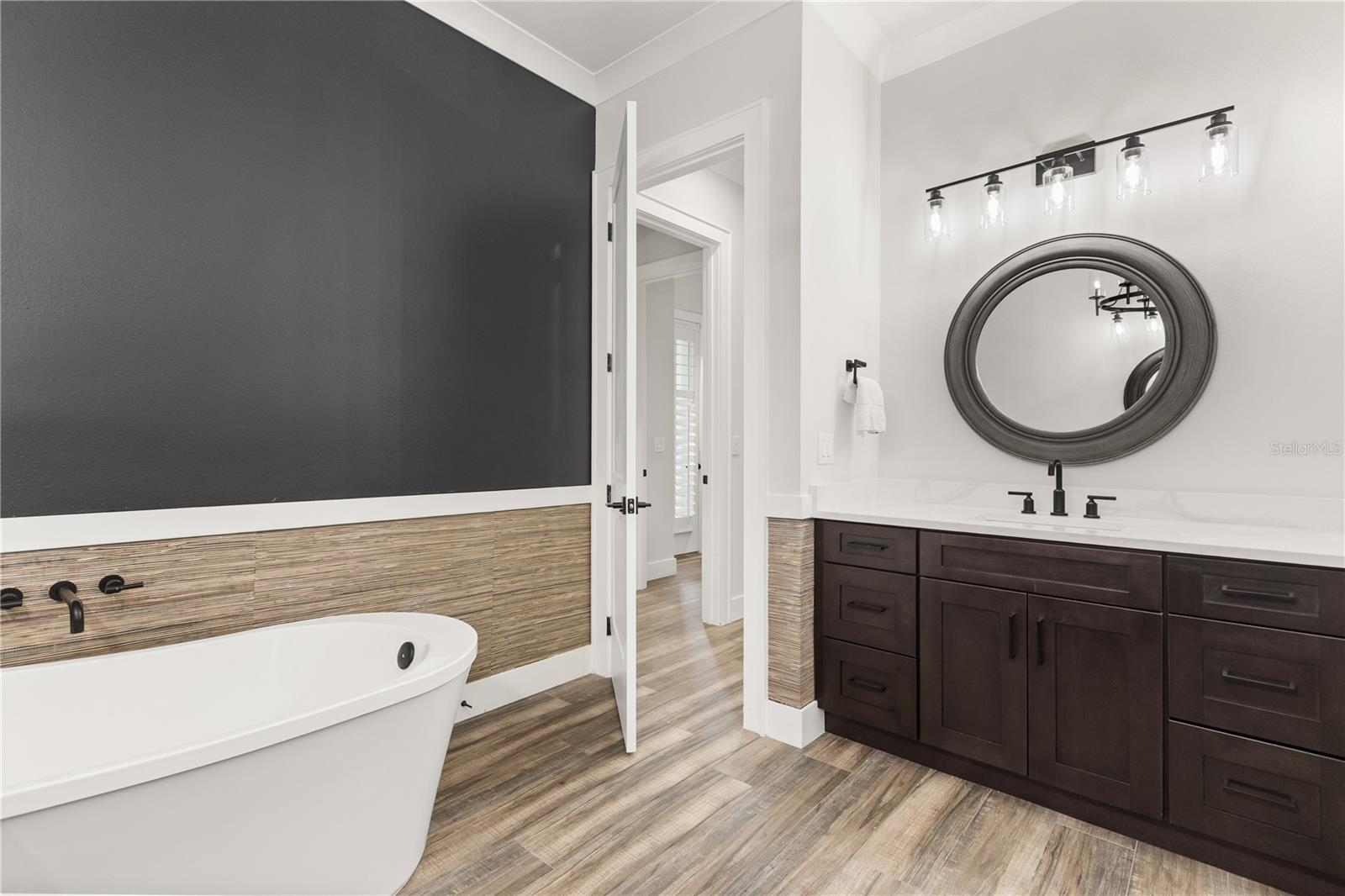 FREESTANDING SOAKING TUBThe primary bath features a freestanding soaking tub, generous vanity storage and a separate walk-in shower.