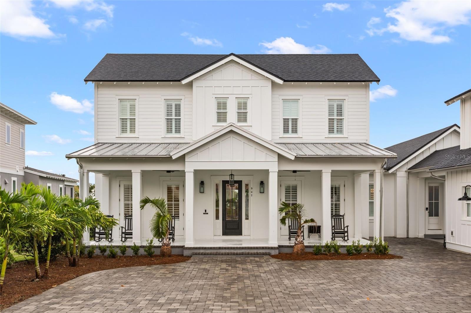 OLD FLORIDA ARCHITECTURE | MAIN RESIDENCE.A wide front porch and classic detailing define this residence in Oakland Park.
