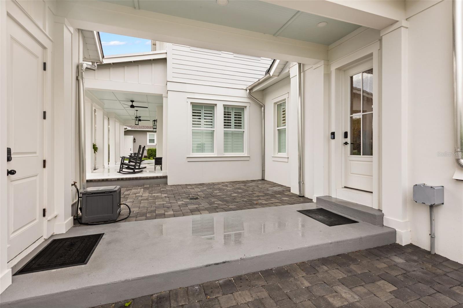 COVERED BREEZEWAYA covered breezeway connects the main residence to the garage and carriage house apartment, creating separation while keeping everything conveniently connected.