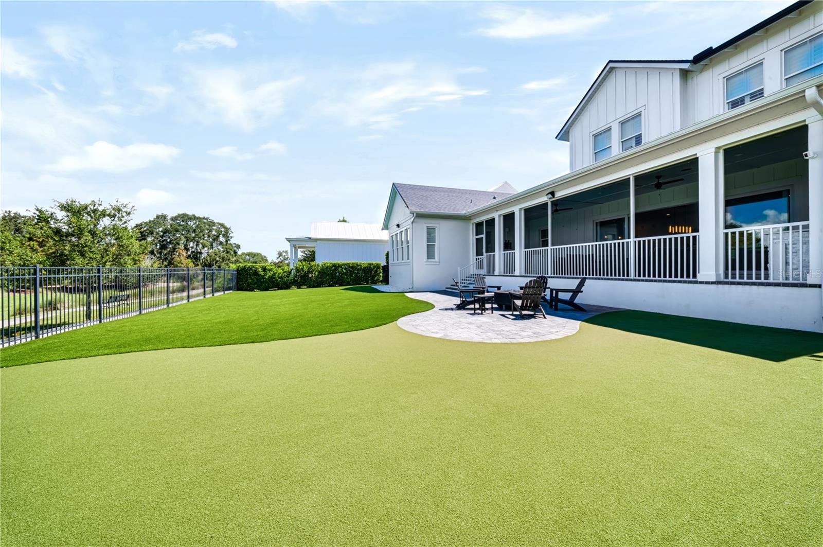 TURF YARD + SCREENED PORCHThe expansive turf backyard extends from the nearly 40-foot screened porch, creating a generous outdoor setting for play, entertaining and future amenities.