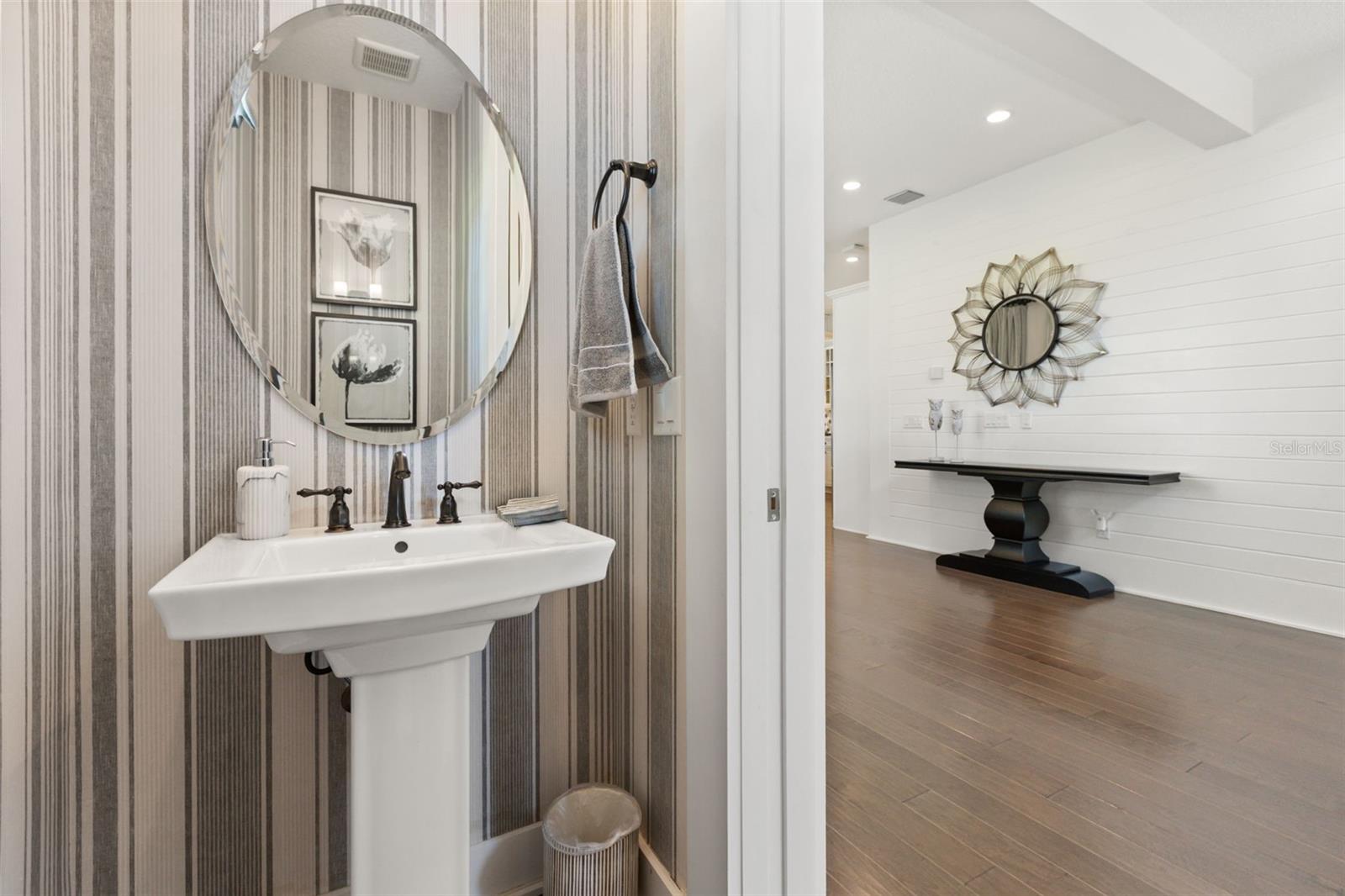 Half bath/powder room directly off front of foyer.