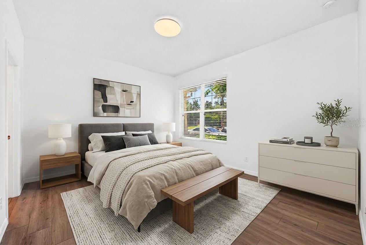 Main floor primary suite. Virtually Staged.