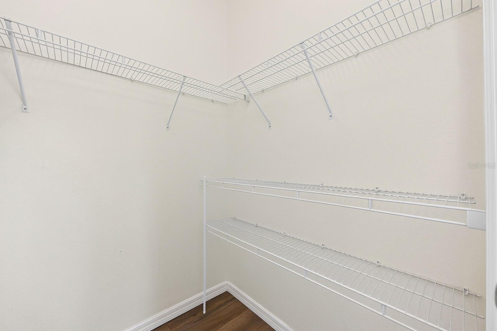 Primary suite walk-in closet.