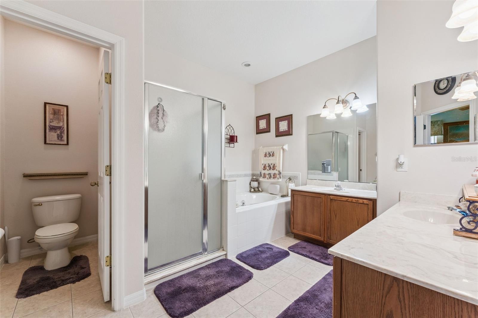 Primary bathroom features a private water closet