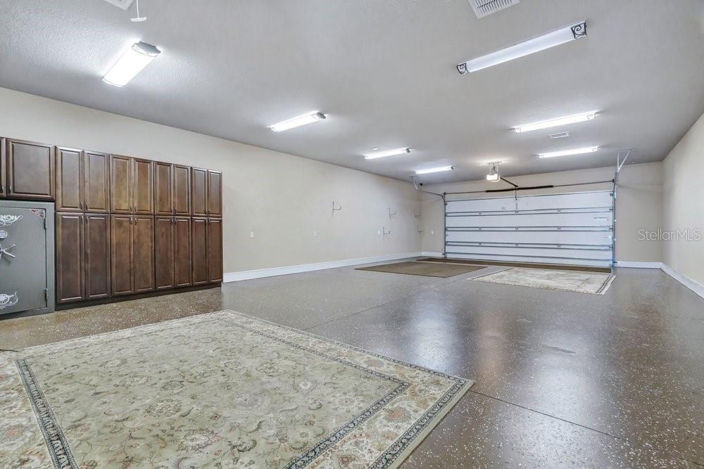 In-Law Suite/Office showcasing 6 car garage with A/C