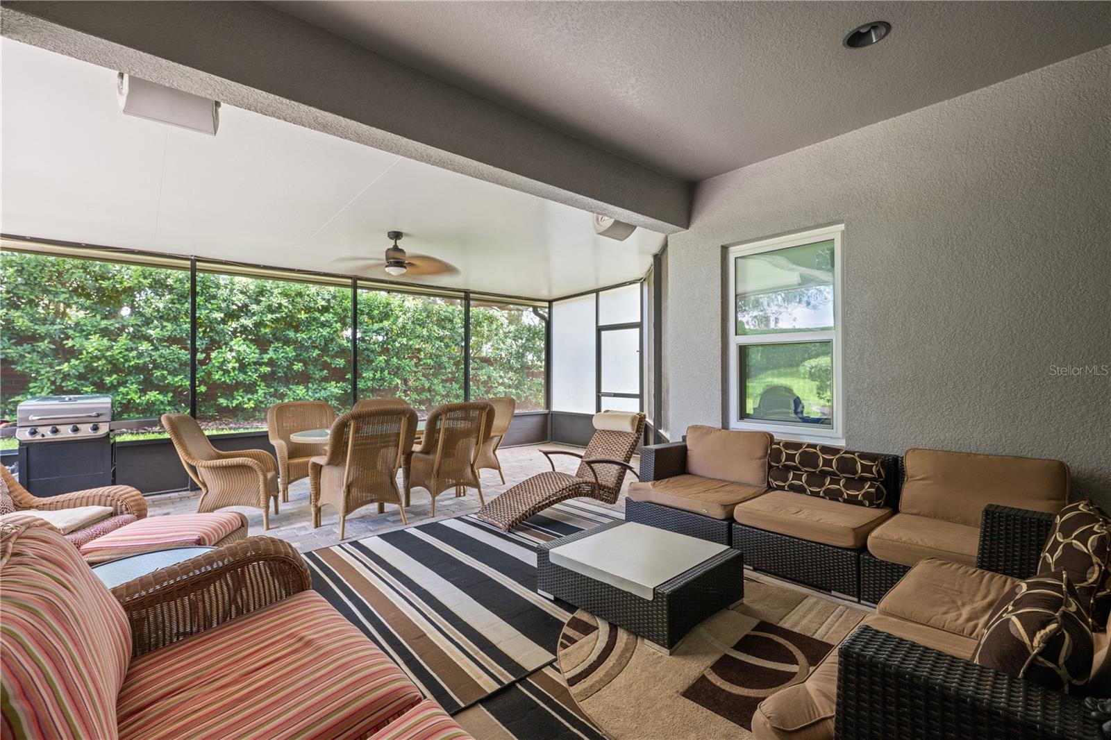 Enjoy year-round Florida living from the oversized covered and screened lanai with an upgraded insulated roof.