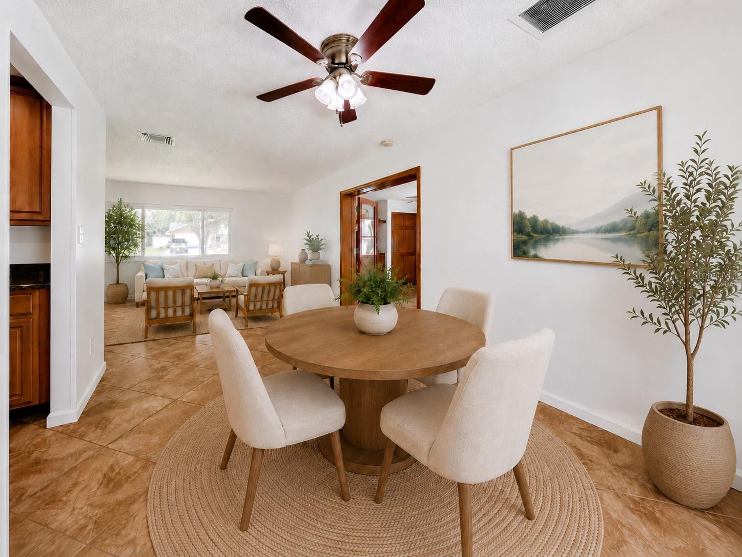 Virtually Staged Dining Room and Living Room/Family Room View