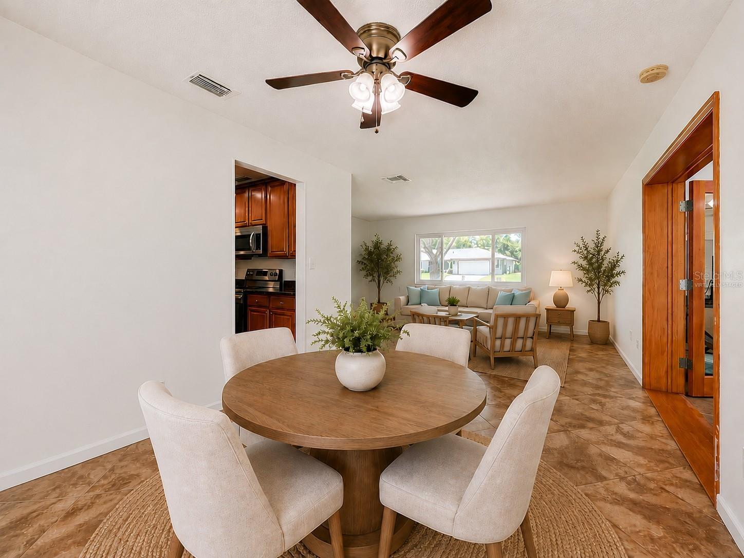 Virtually Staged Dining Room and Living Room/Family Room View