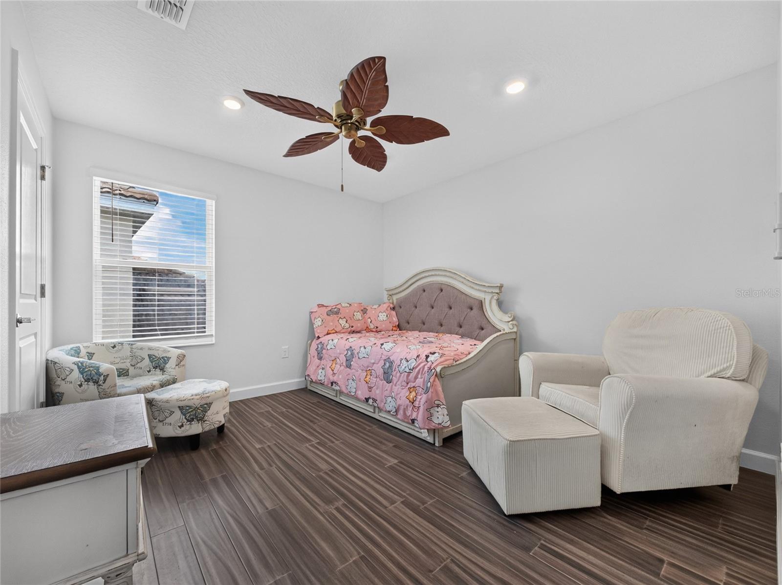 2nd level guest room with luxury vinyl flooring
