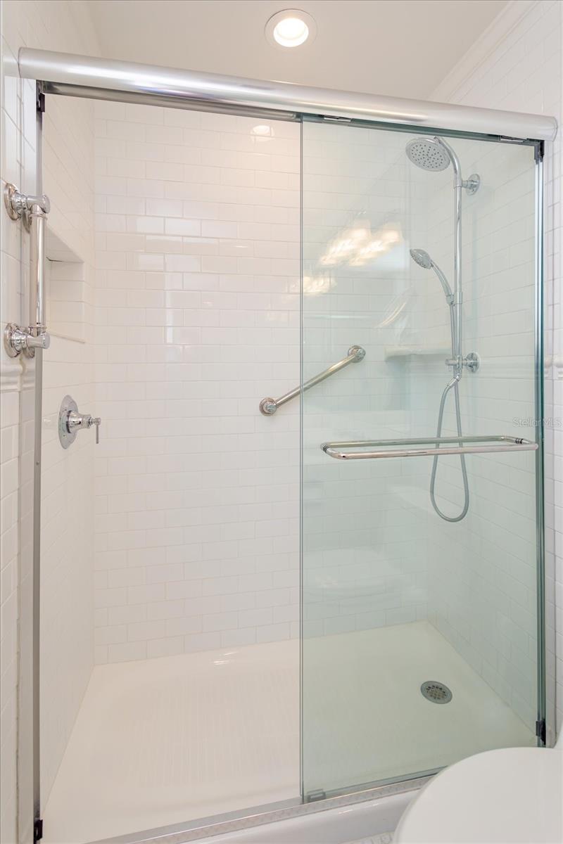 Primary Bath updated step in shower, tile, glass door, faucet