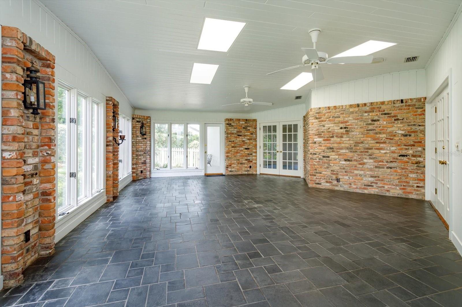 Florida Room has door to yard and open to Kitchen, Family and Breakfast rooms
