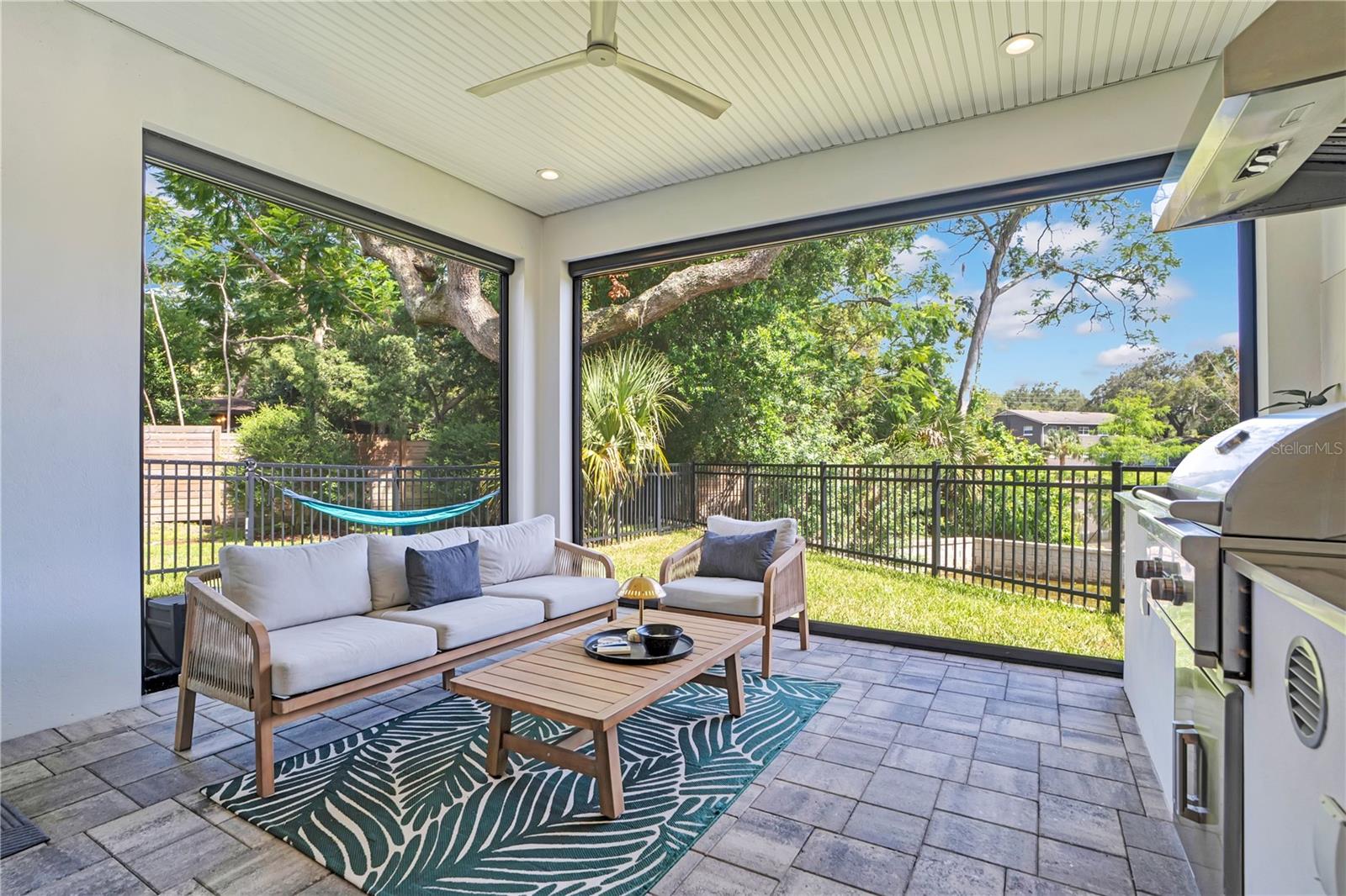 Summer kitchen with roll away screens