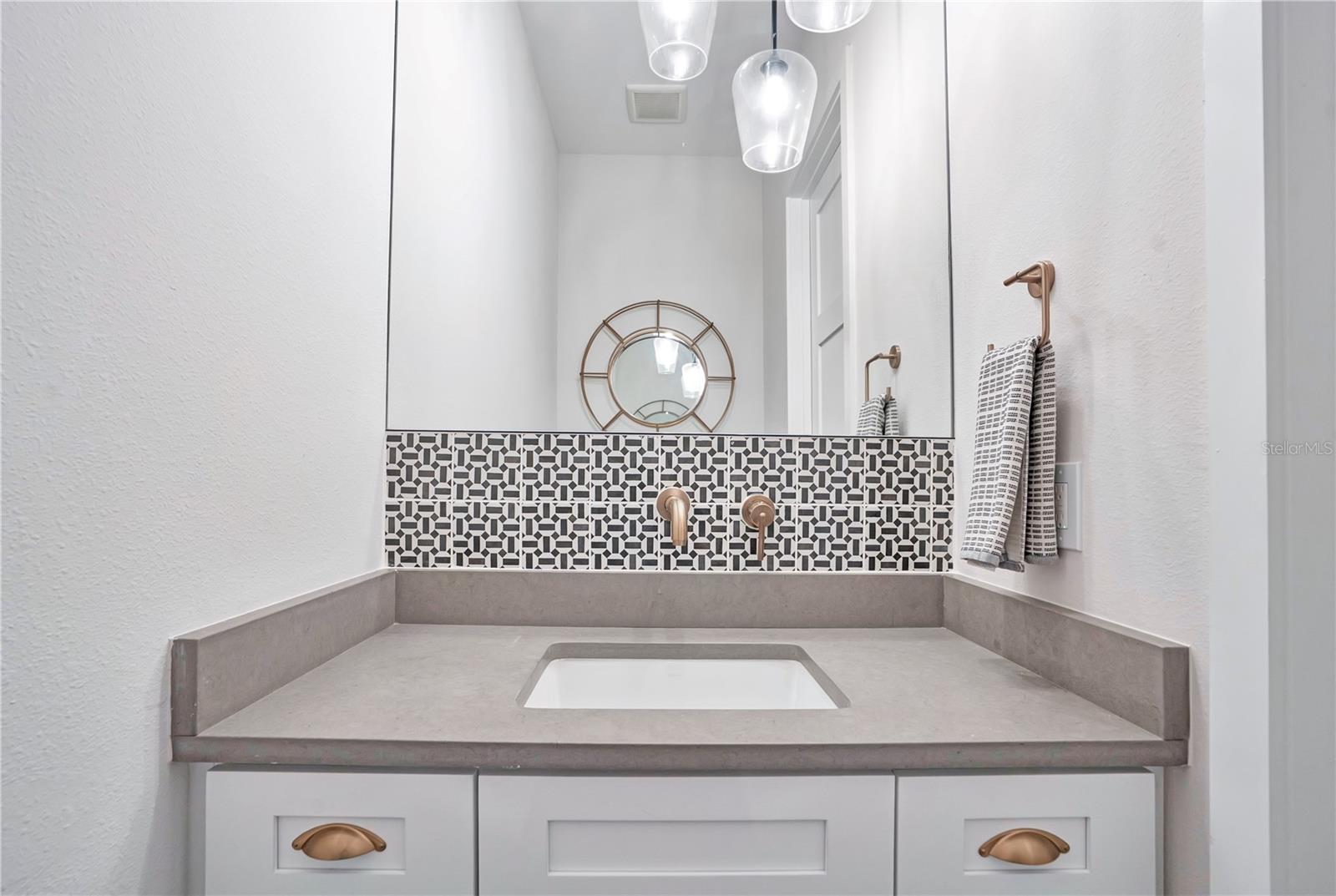 Powder bath off entry way first floor