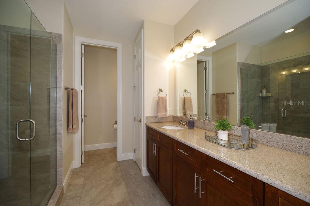 PRIMARY BATHROOM WITH DUAL SINKS AND SHOWER