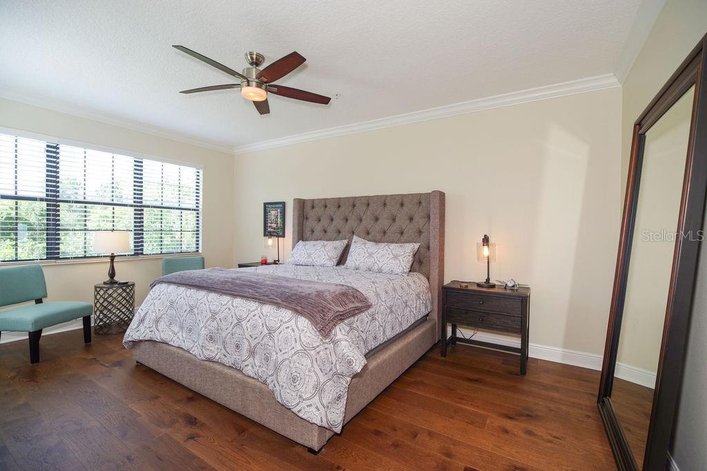PRIMARY BEDROOM OVERLOOKING CONSERVATION, GOLF AND WATER